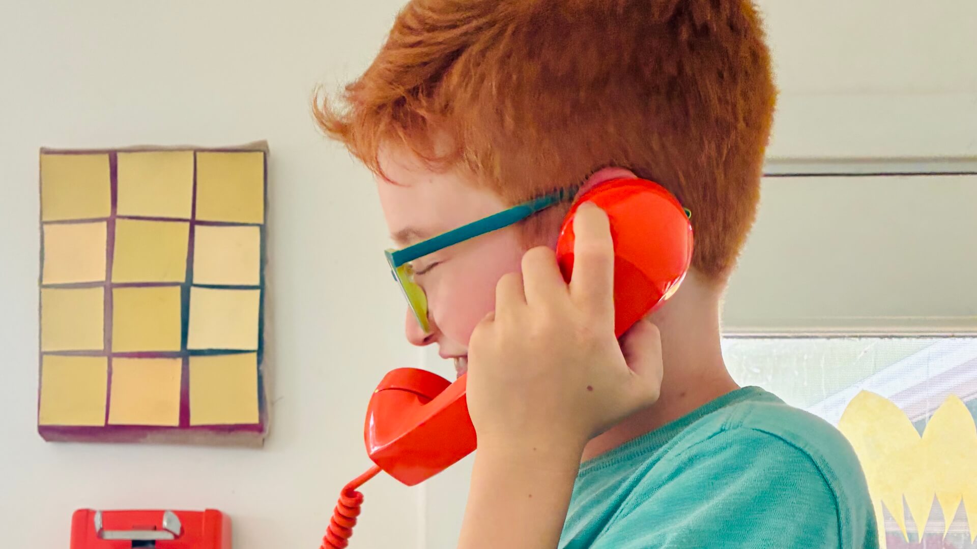 Middle School male student on phone smiling