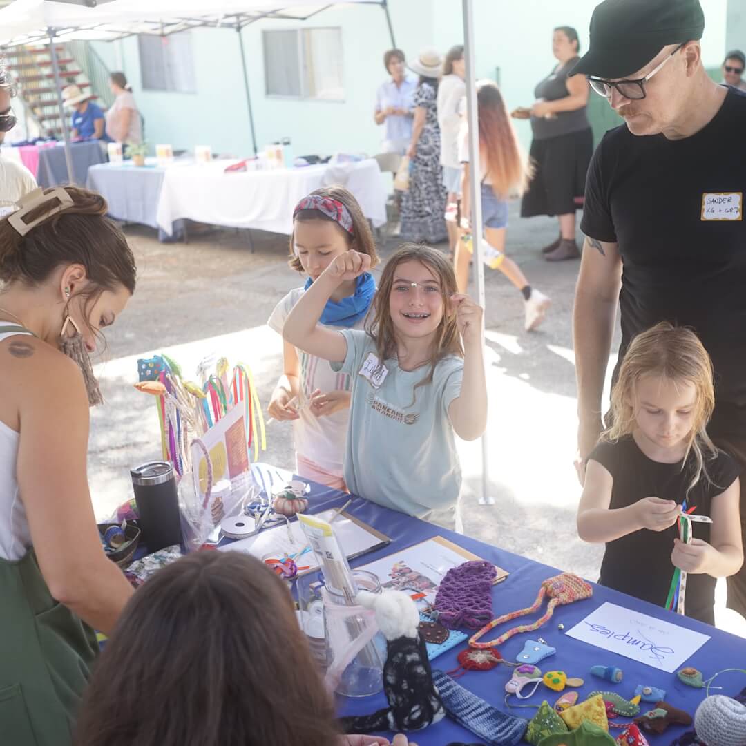 Families at arts and crafts table.