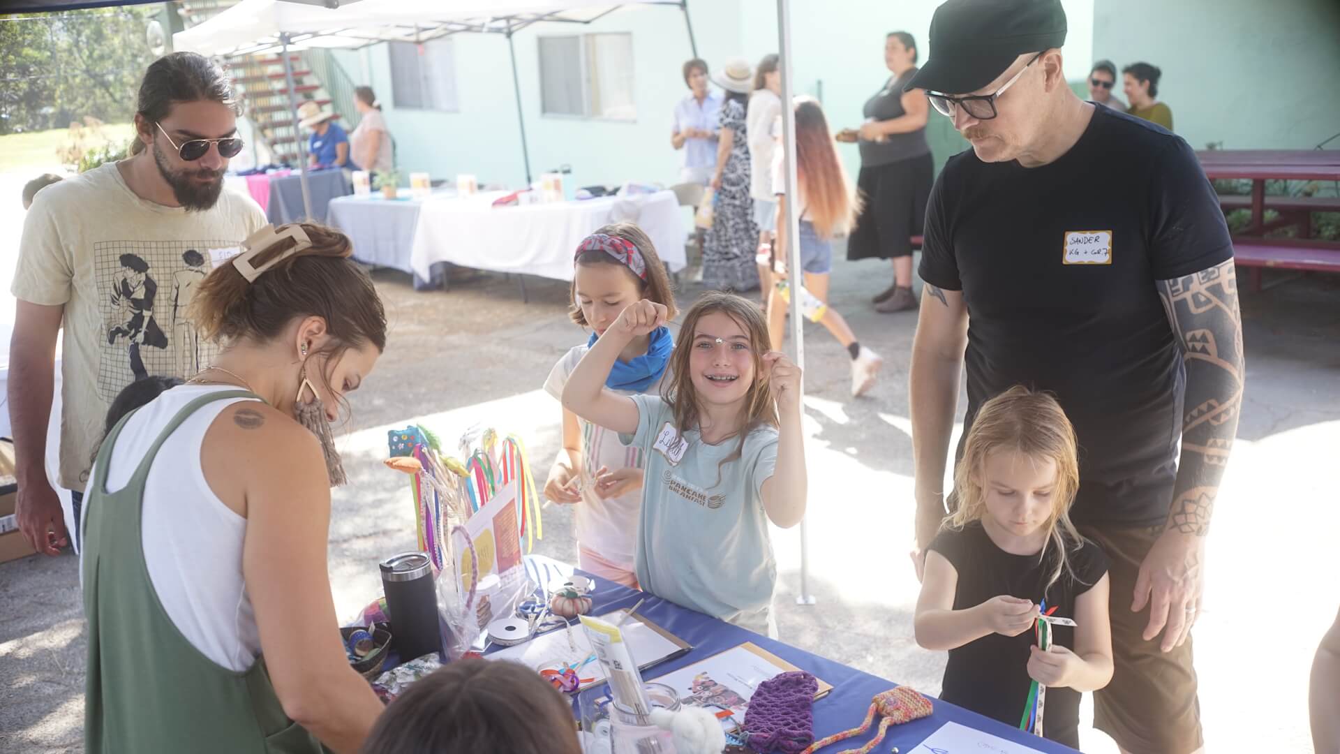 Families at arts and crafts table.