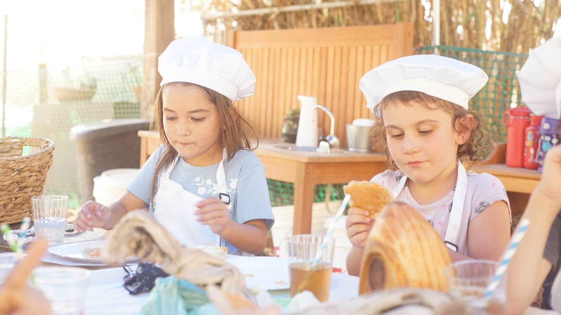 Lower School female students learn baking.