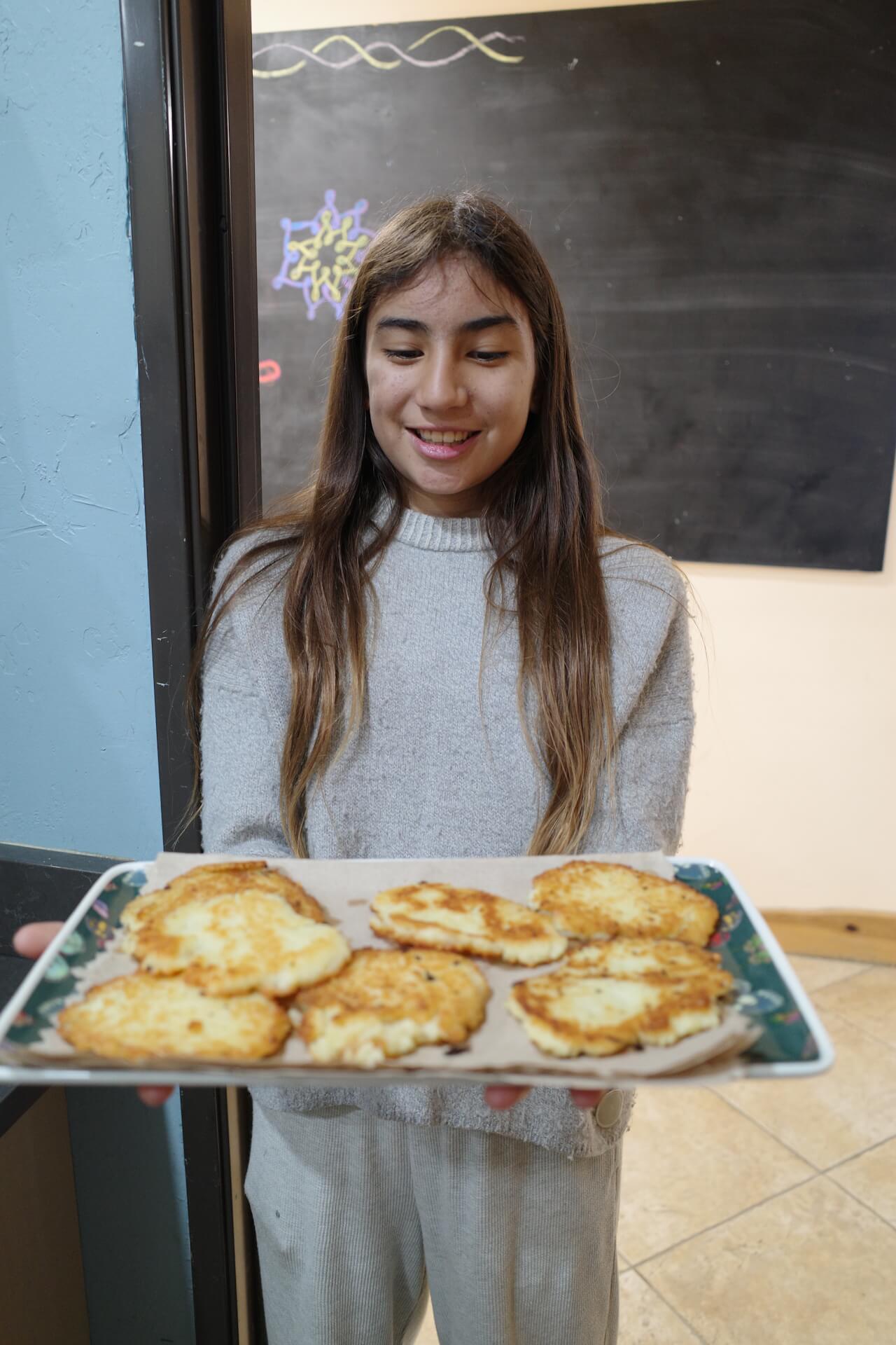 Middle School female student with baked goods.