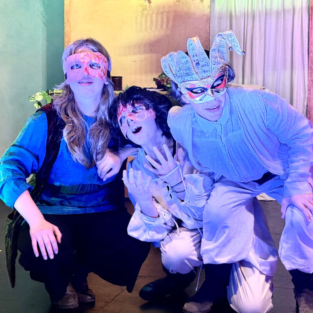 Middle School students perform in play in theater.