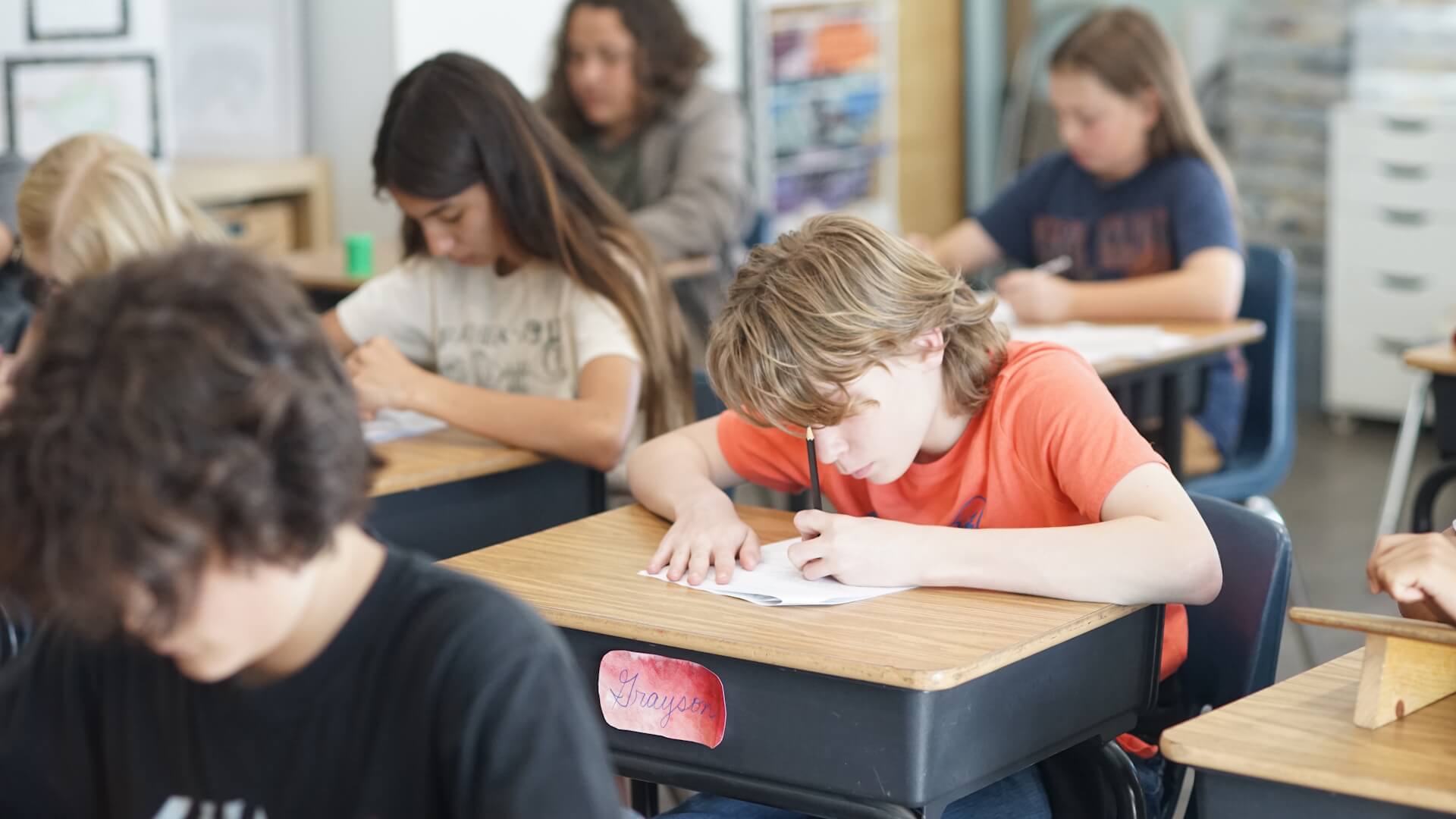 Middle School students take a test in class.