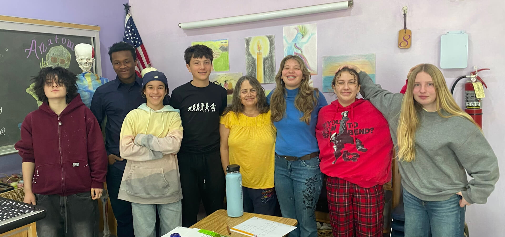 Middle School students and teacher in art class.