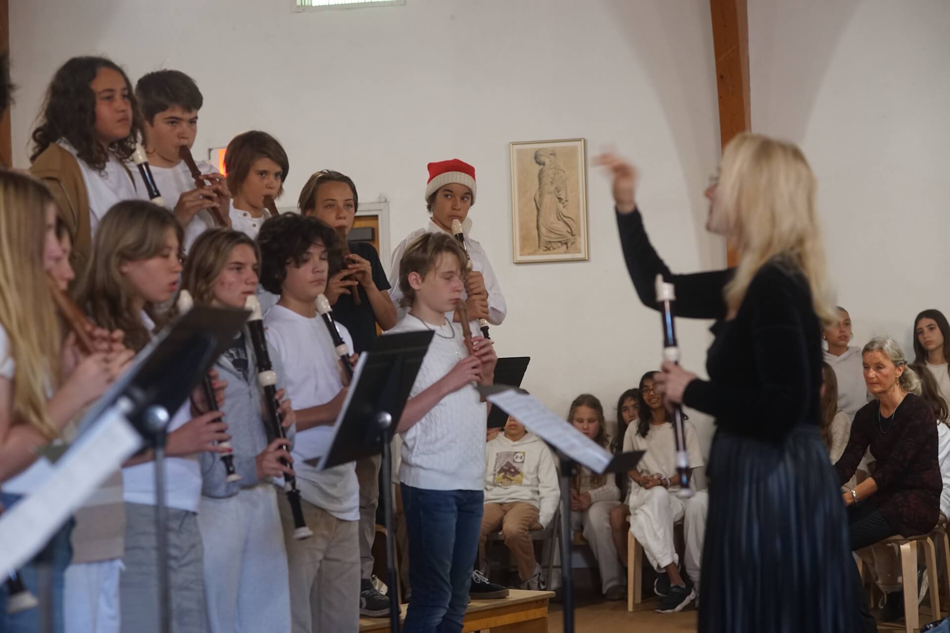 Students perform a concert under direction.