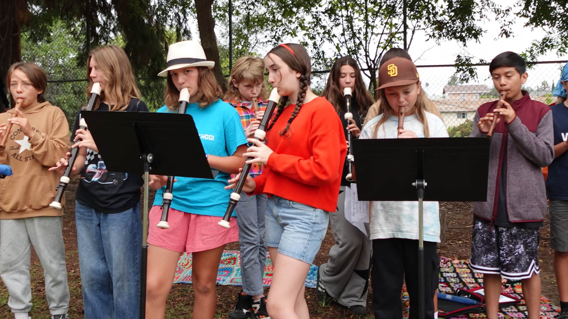Students play instruments in a concert.