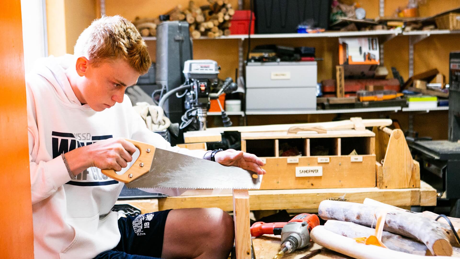 High School male student in woodshop.
