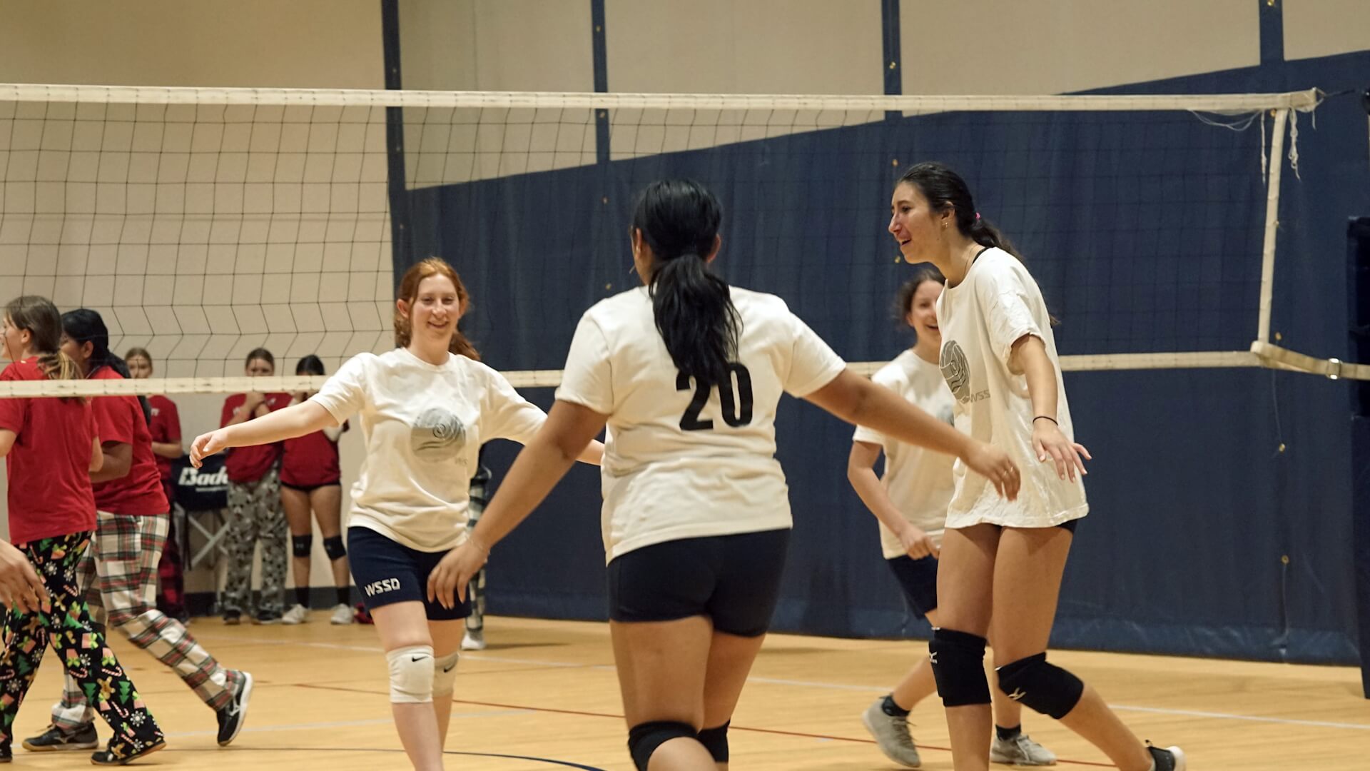 High School female students playing volleyball
