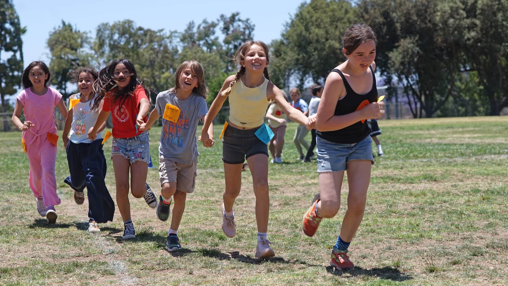 Lower School students running in a field