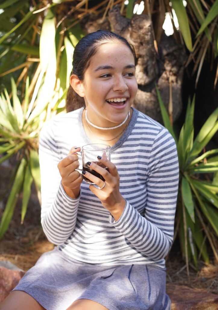 Middle School female student drinks coffee