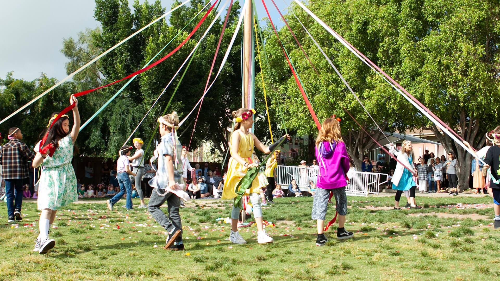 Students decorate the May pole on May Day