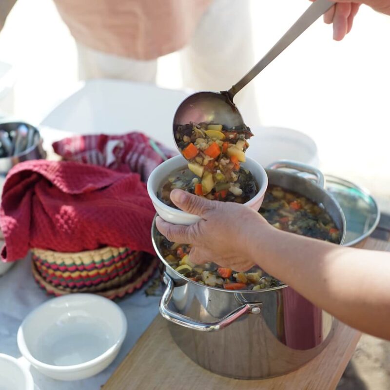 Teacher serving soup on Soup Day