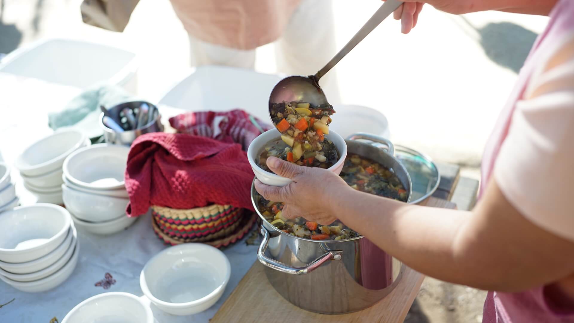 Teacher serving soup on Soup Day